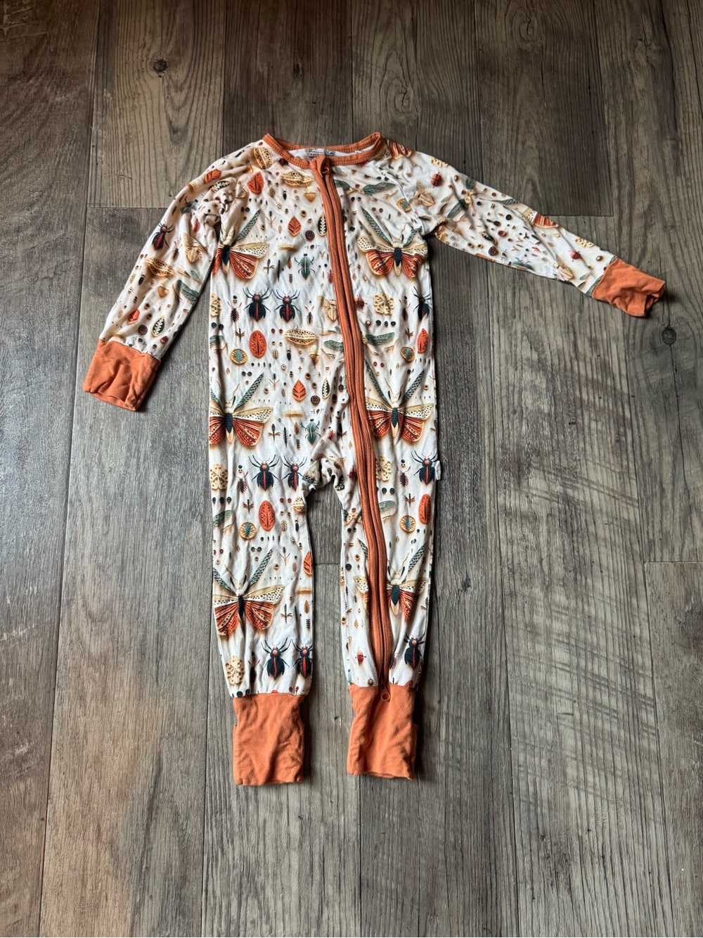 Wren Ivy Co One-Piece Bug & Butterfly Print Zipper Romper in Cream and Orange